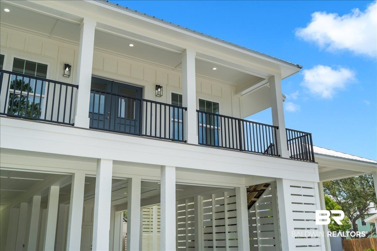 Image 2: White exterior with board and batten siding