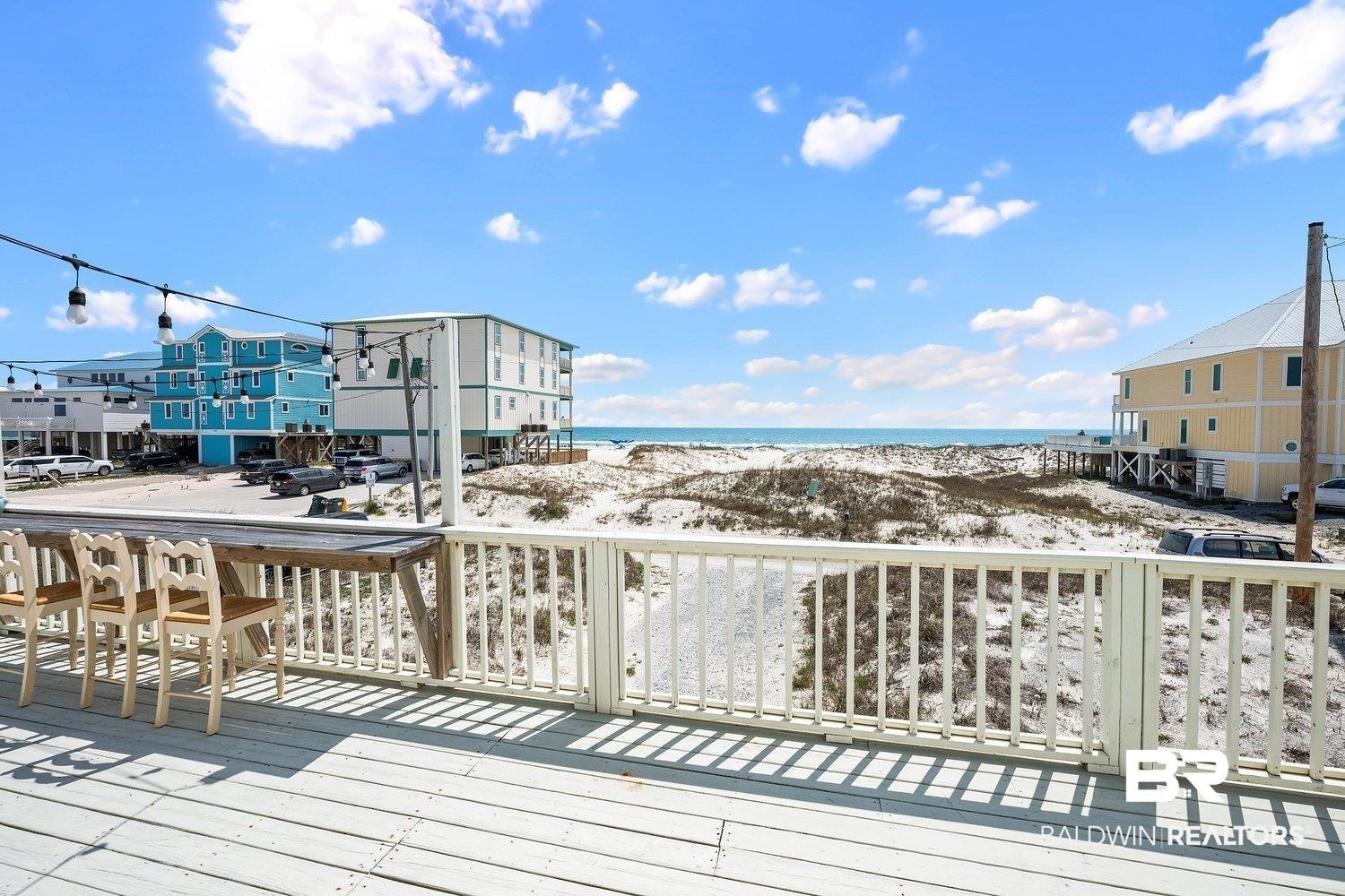 Image 3: Deck featuring view of water and beach