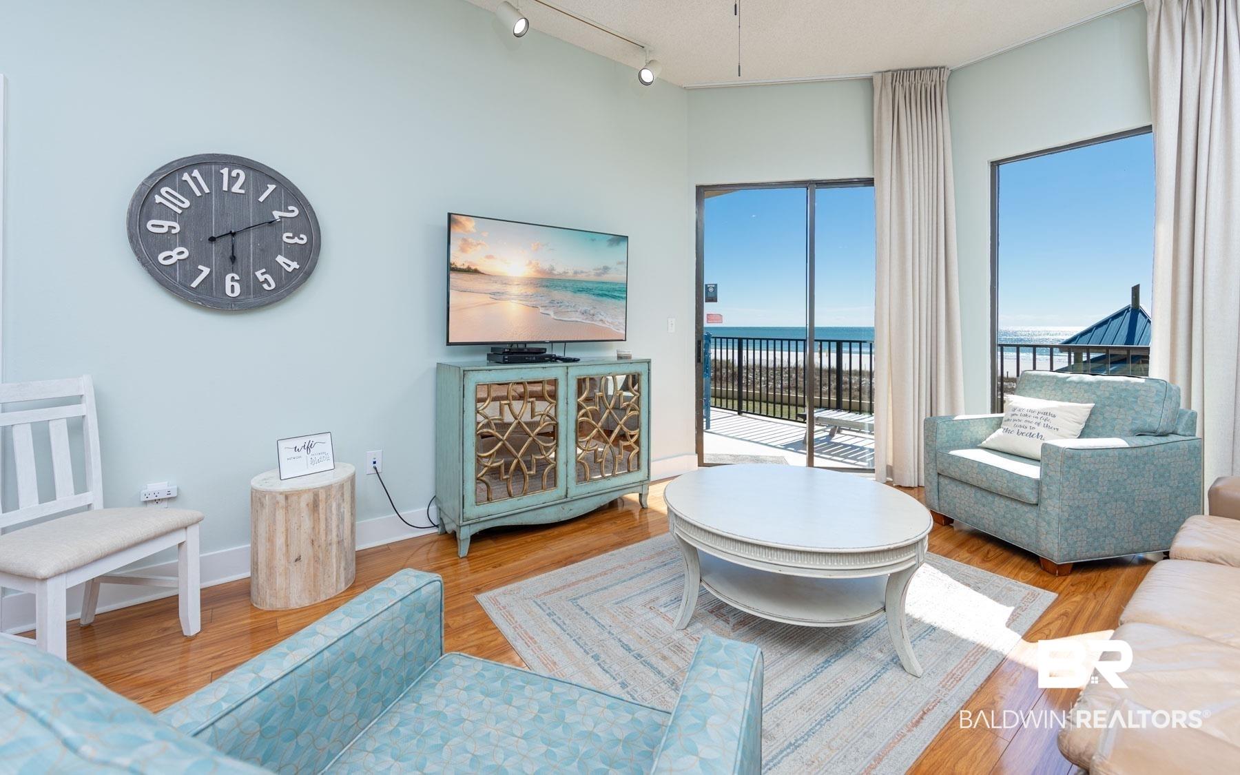 Image 2: Light blue interior walls with wood-finish flooring