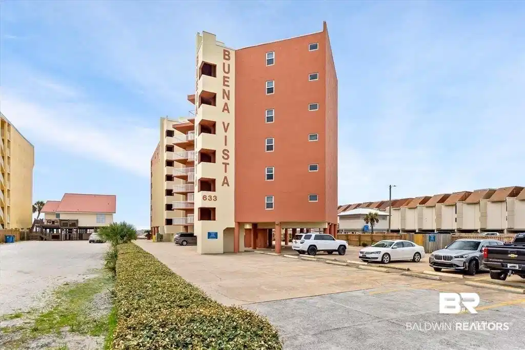 Image 1: View of apartment building / complex featuring uncovered parking
