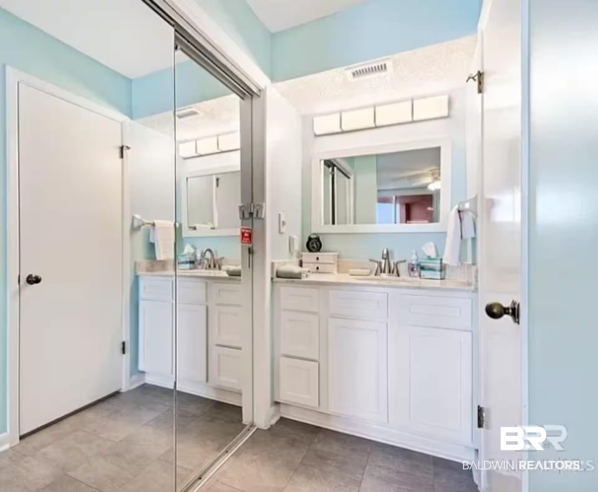Image 3: Full bath featuring two vanities