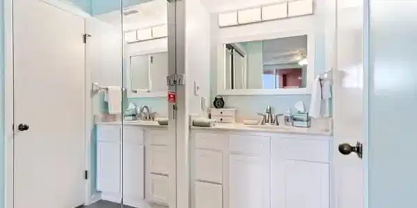 Image 3: Full bath featuring two vanities