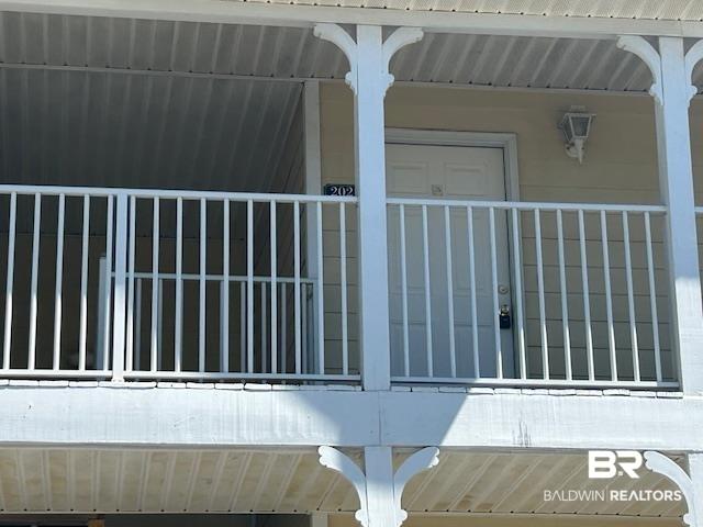 Image 4: Exterior balcony featuring white balusters and decorative corbels