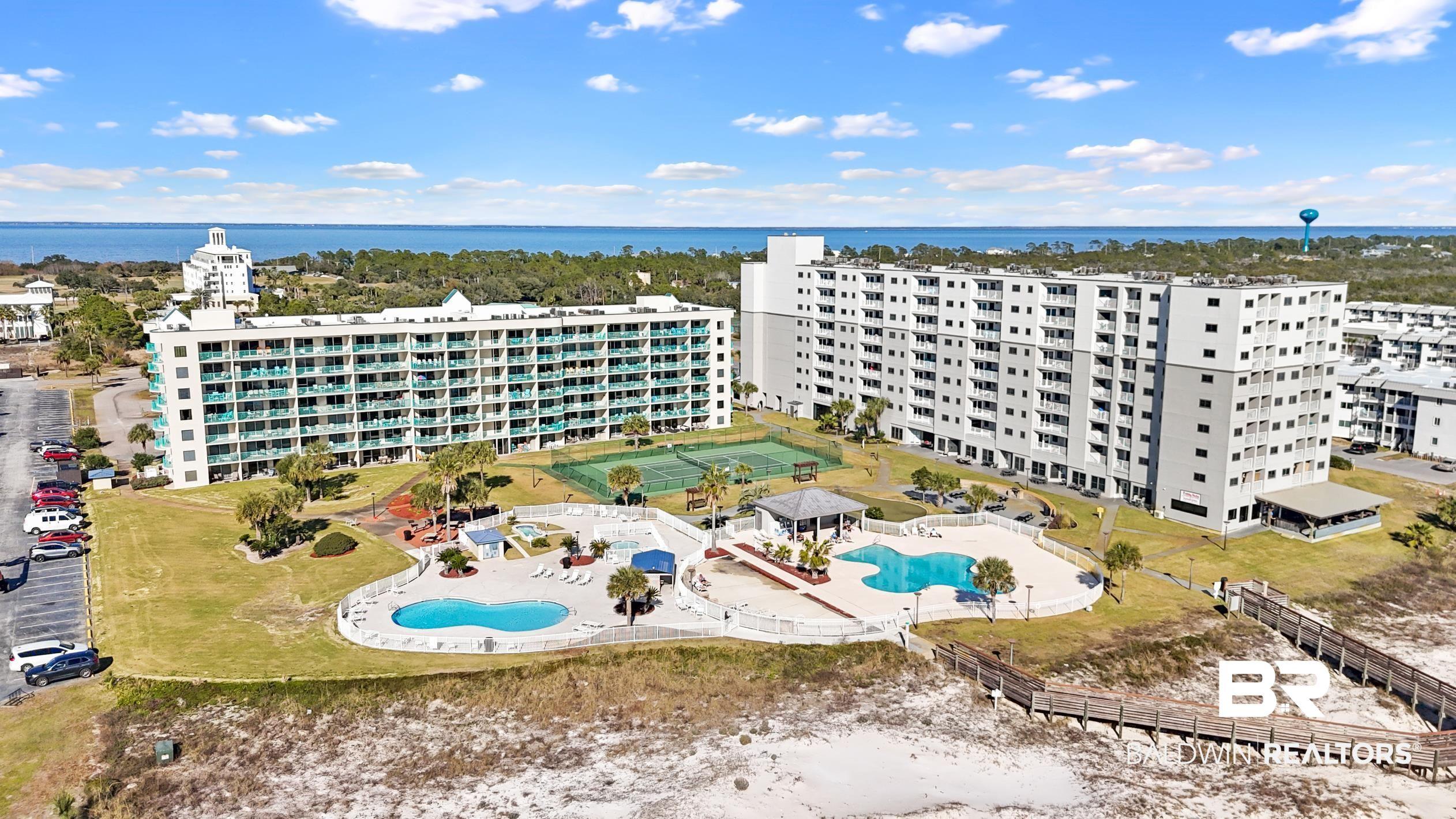 Image 2: Aerial view of a pool and apartment complex / building