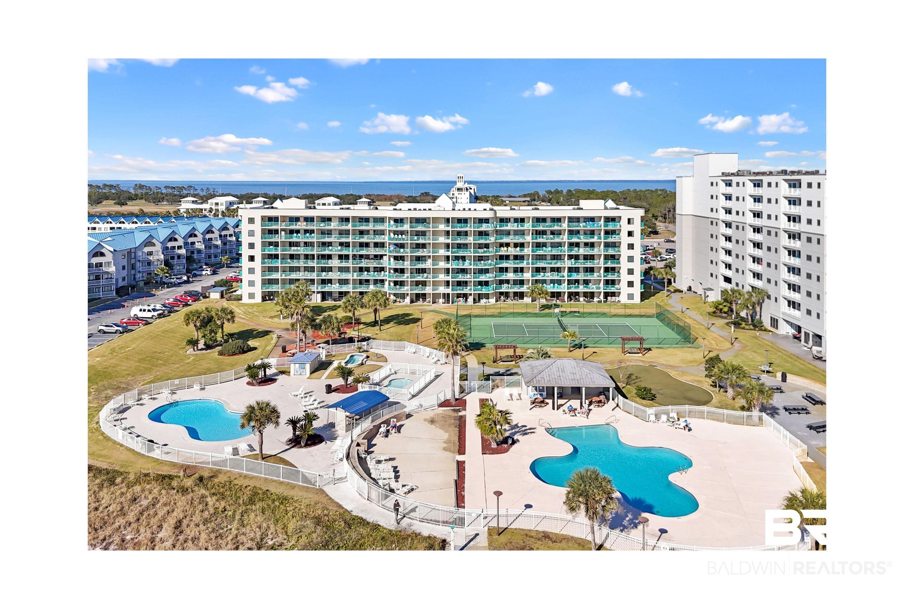 Image 3: Drone / aerial view of a pool area and apartment complex / building