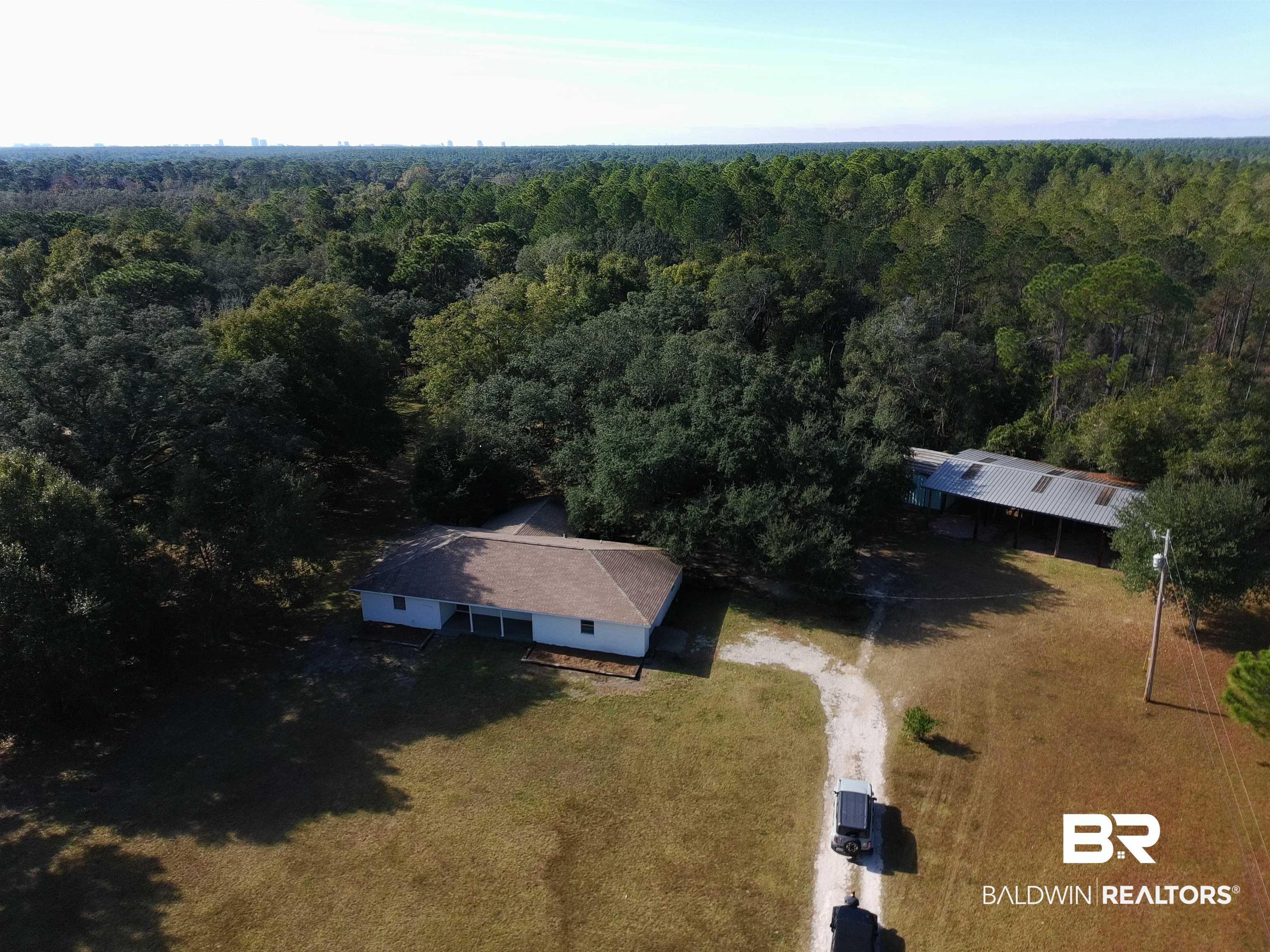 Image 2: Aerial view of property and surrounding area