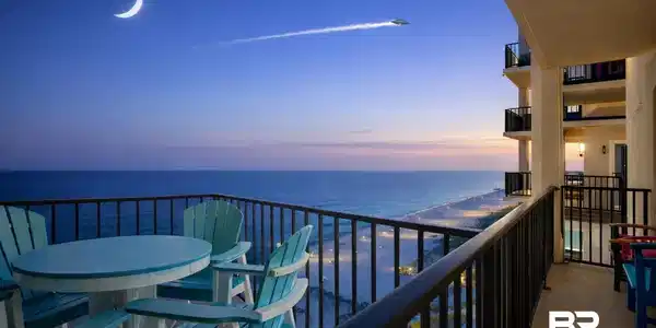 Image 2: Balcony featuring a water view