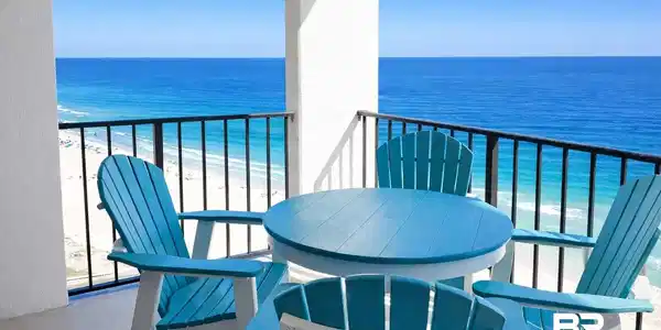 Image 3: Balcony featuring view of water and beach