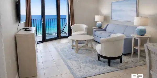 Image 4: Living area featuring crown molding and light tile patterned floors