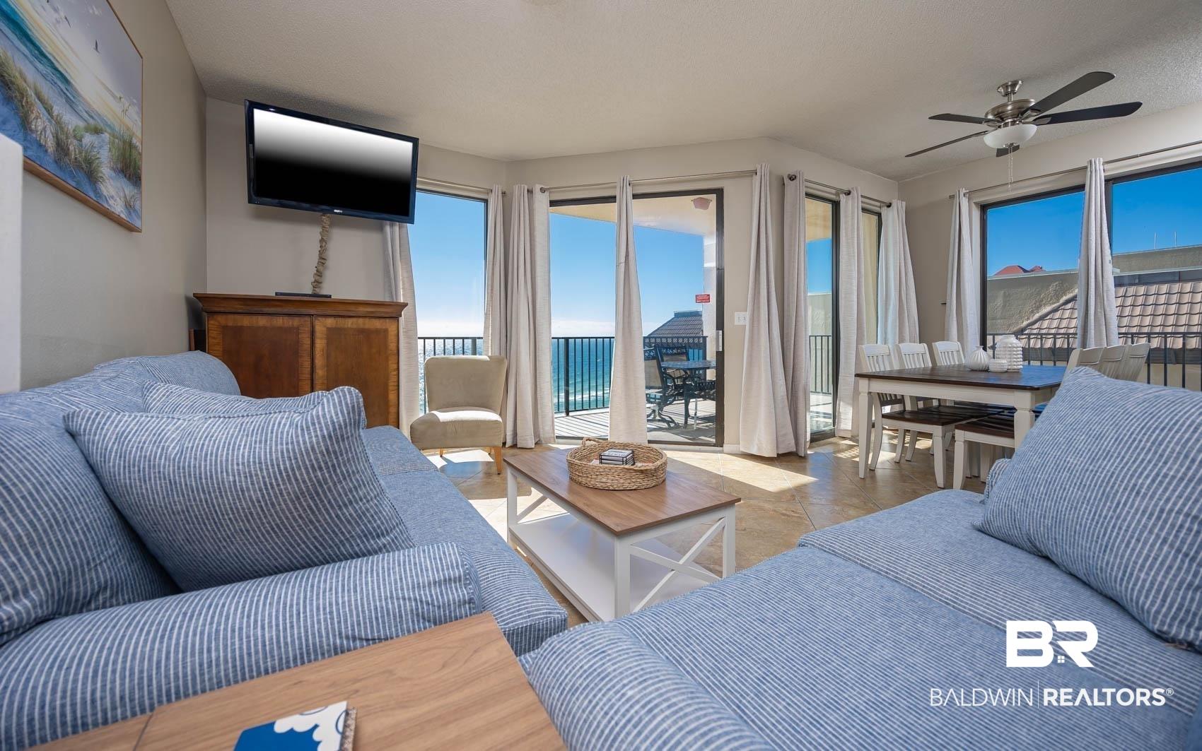 Image 3: Living area with a ceiling fan