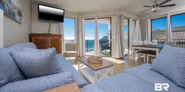 Image 3: Living area with a ceiling fan