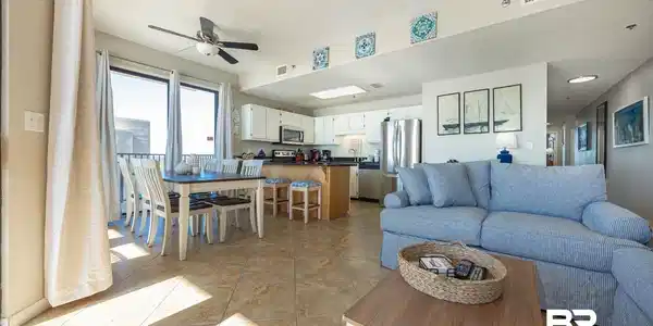 Image 4: Living area featuring ceiling fan and a textured ceiling
