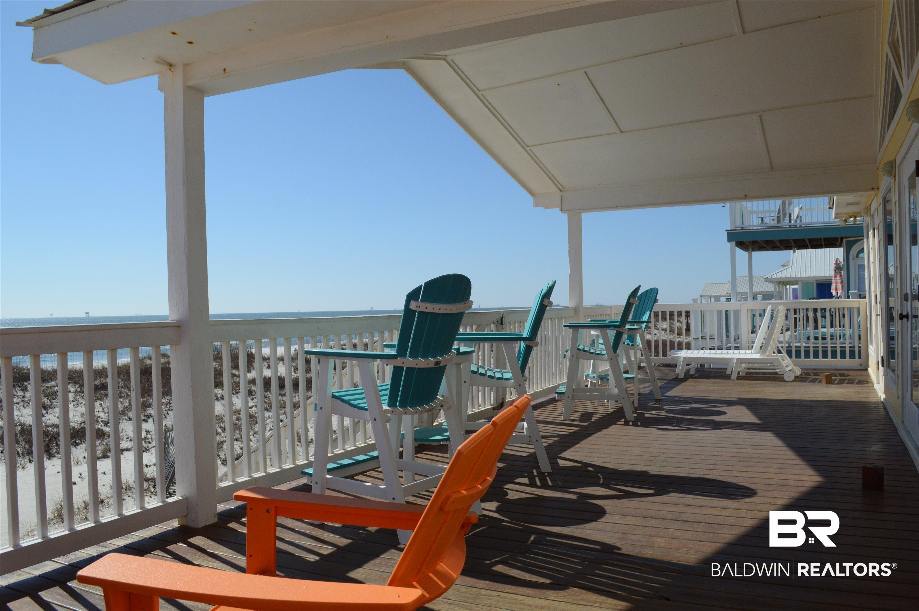 Image 4: Soak up the sun and watch the dolphins play from our wide and spacious Beach side deck.
