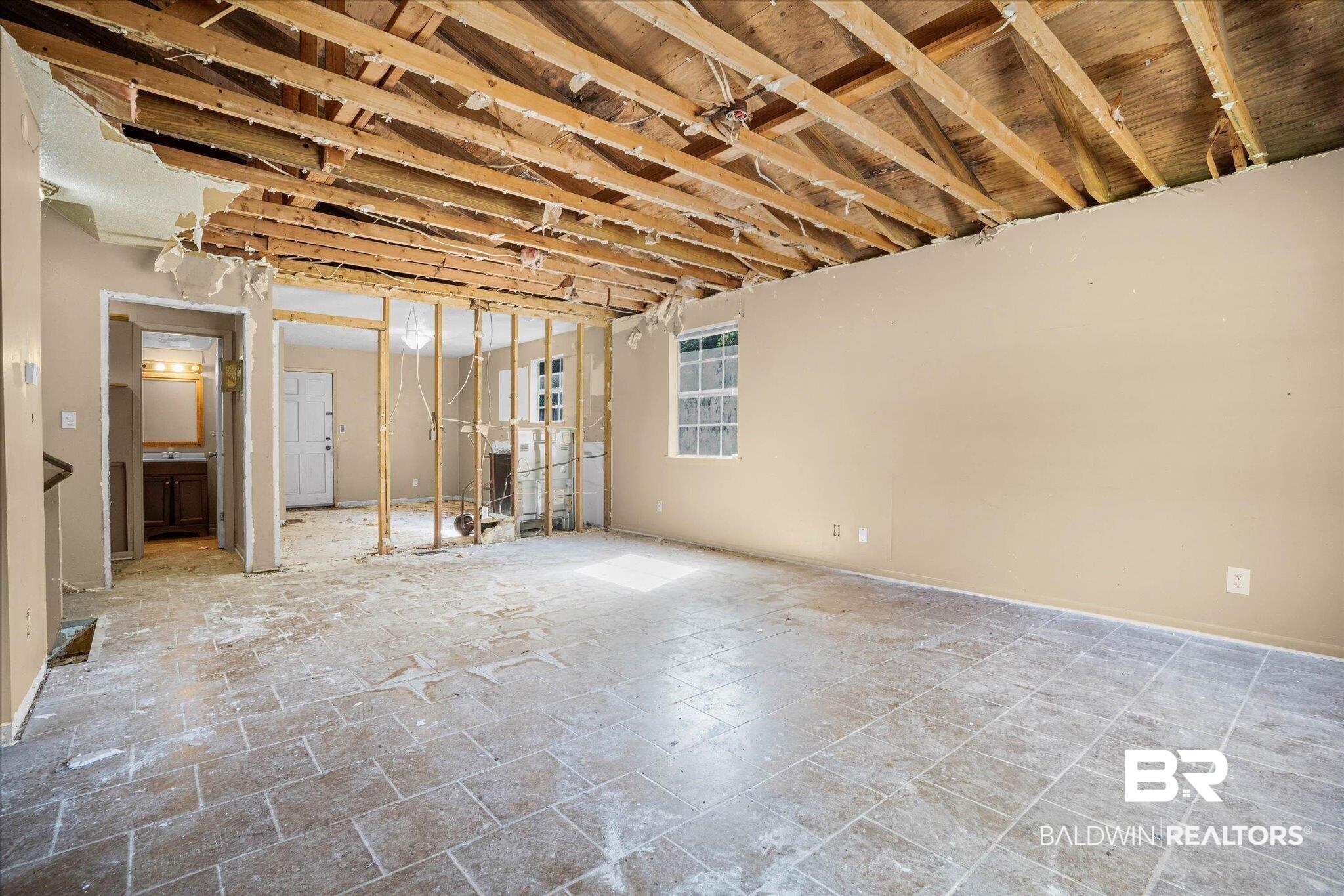 Image 2: Exposed ceiling joists revealing structural elements