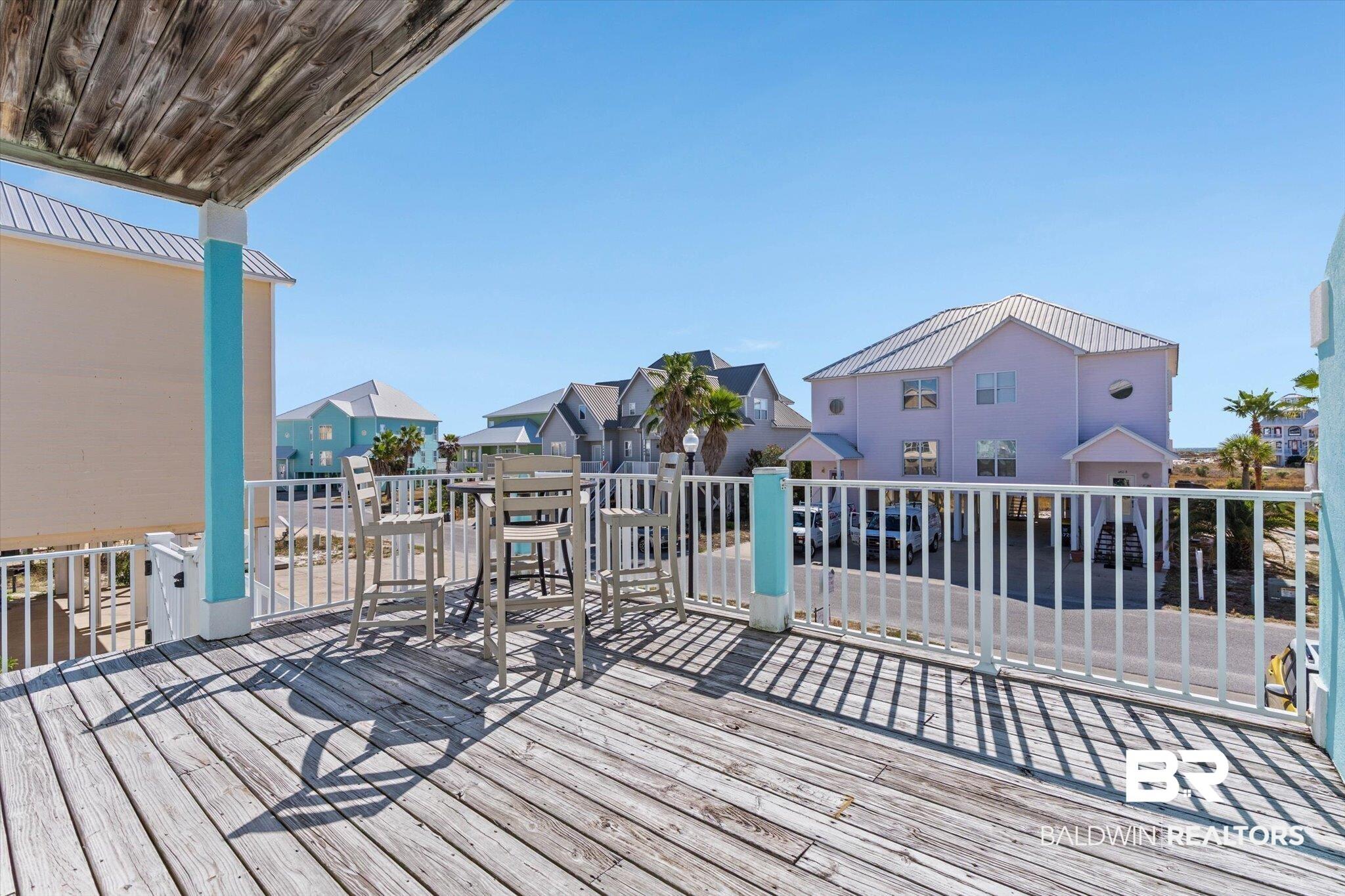 Image 3: Wooden terrace with a residential view