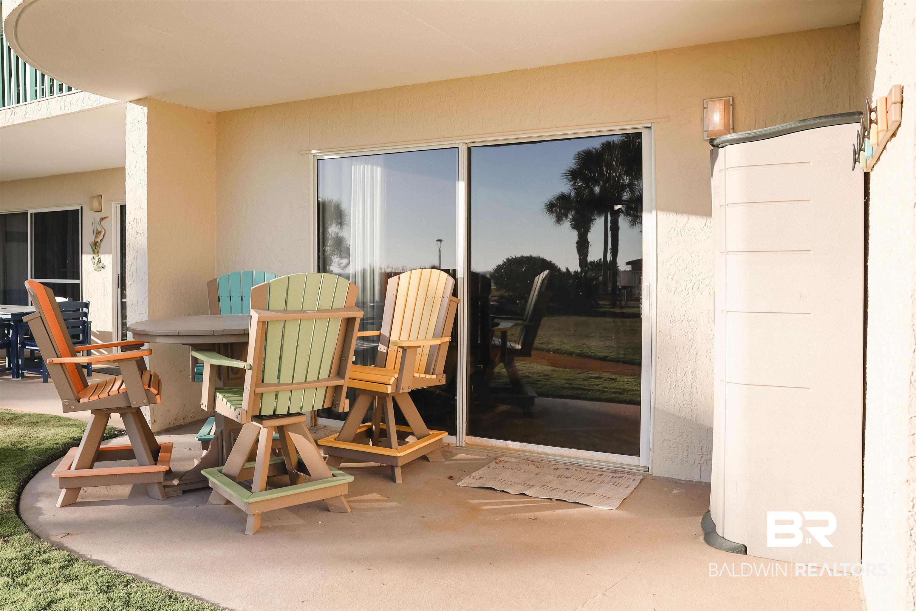 Image 2: View of patio with outdoor dining area