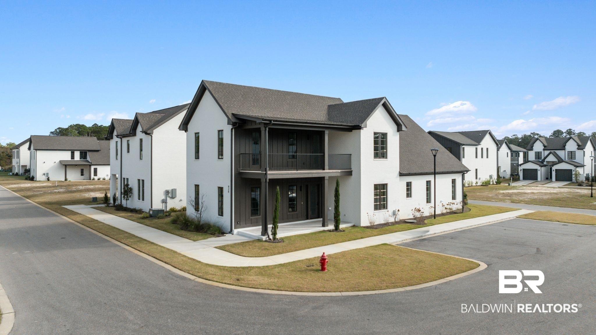 Image 1: View of building exterior featuring a residential view