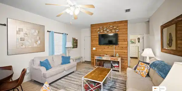 Image 2: Tiled living room featuring ceiling fan