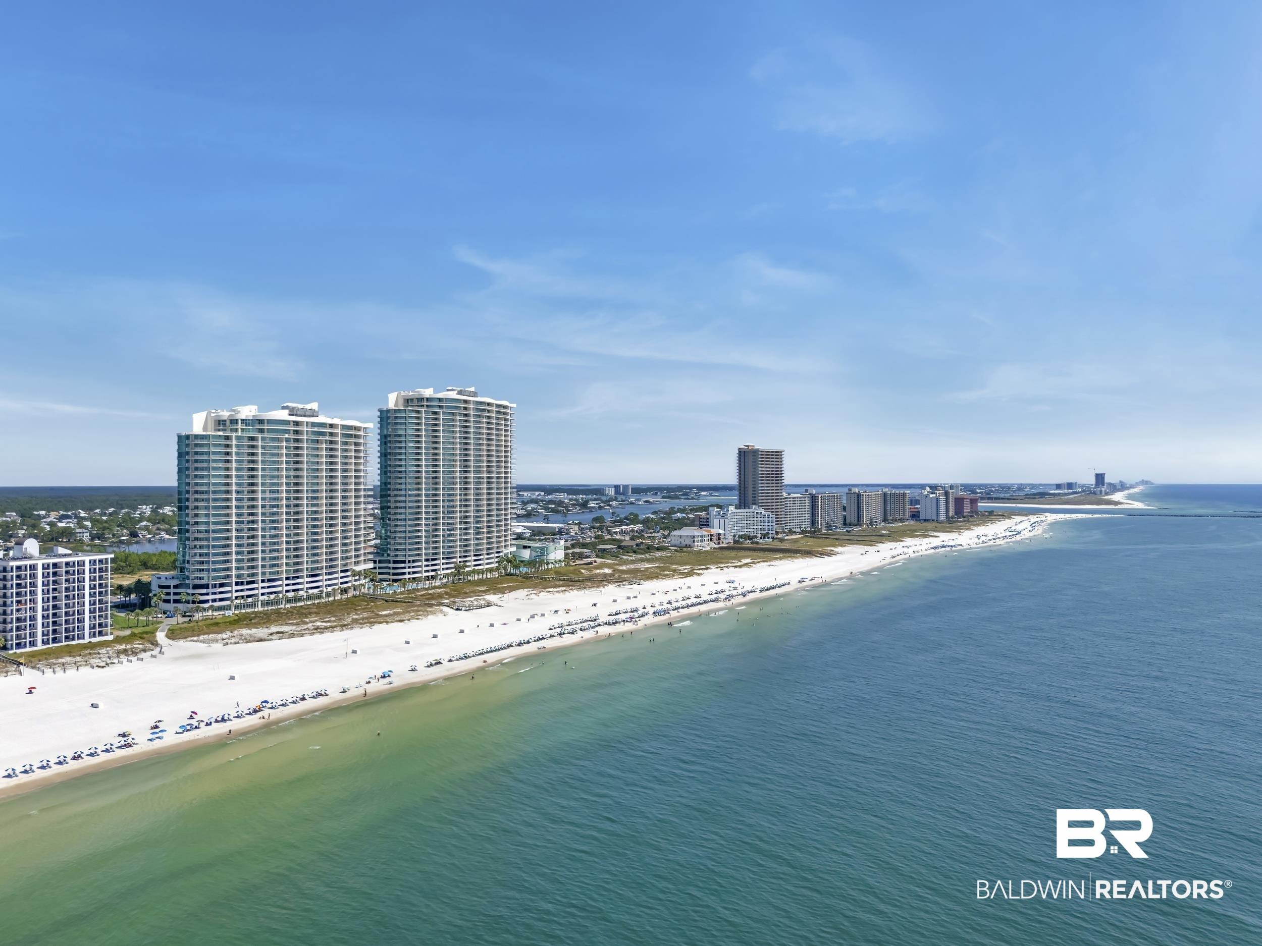 Image 4: View of urban area with waterfront with a beach