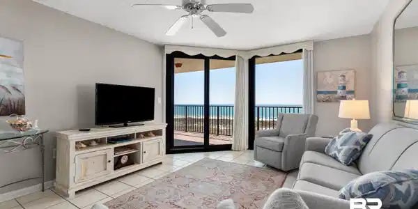Image 3: Living room with a ceiling fan, a textured ceiling, and light tile patterned floors