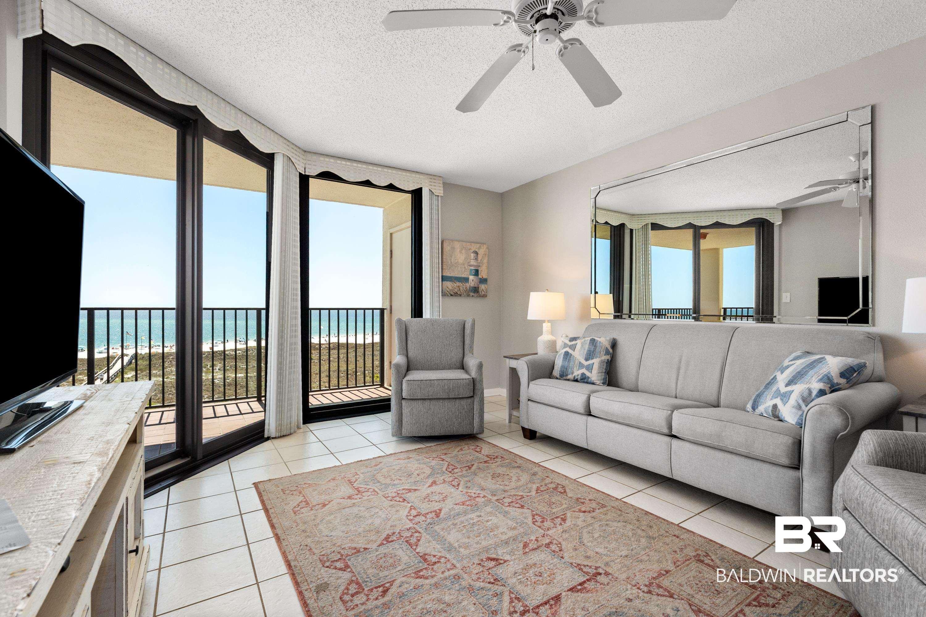 Image 4: Living room featuring a textured ceiling and a ceiling fan