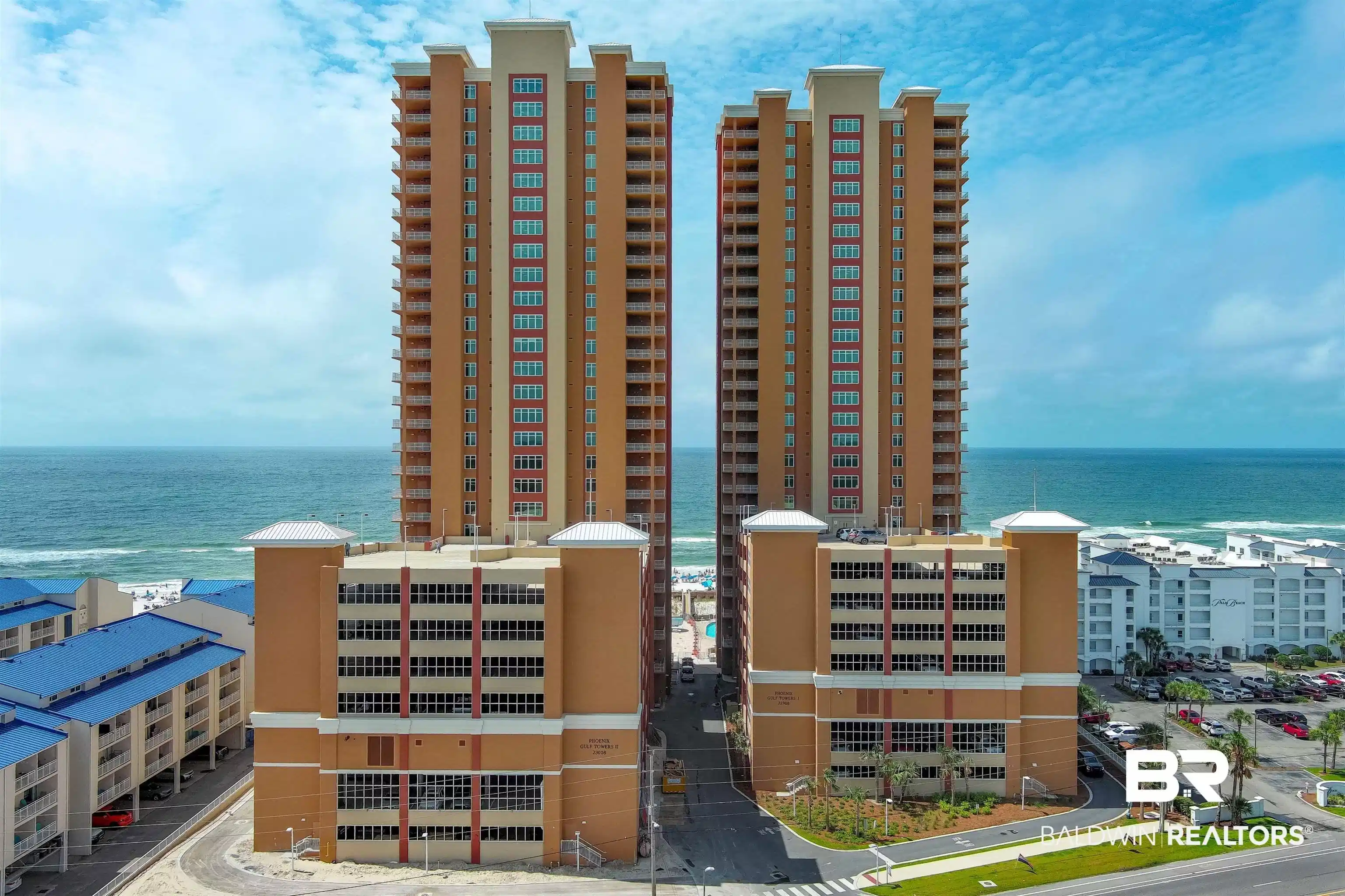 Image 1: View of building exterior with a water view