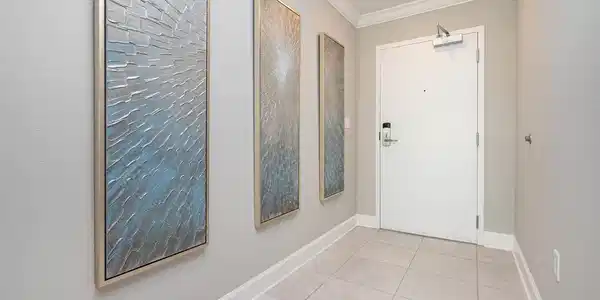 Image 3: Doorway with tile patterned floors and ornamental molding