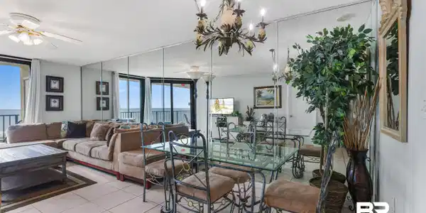 Image 3: Dining room featuring tile patterned flooring, a chandelier, and a ceiling fan