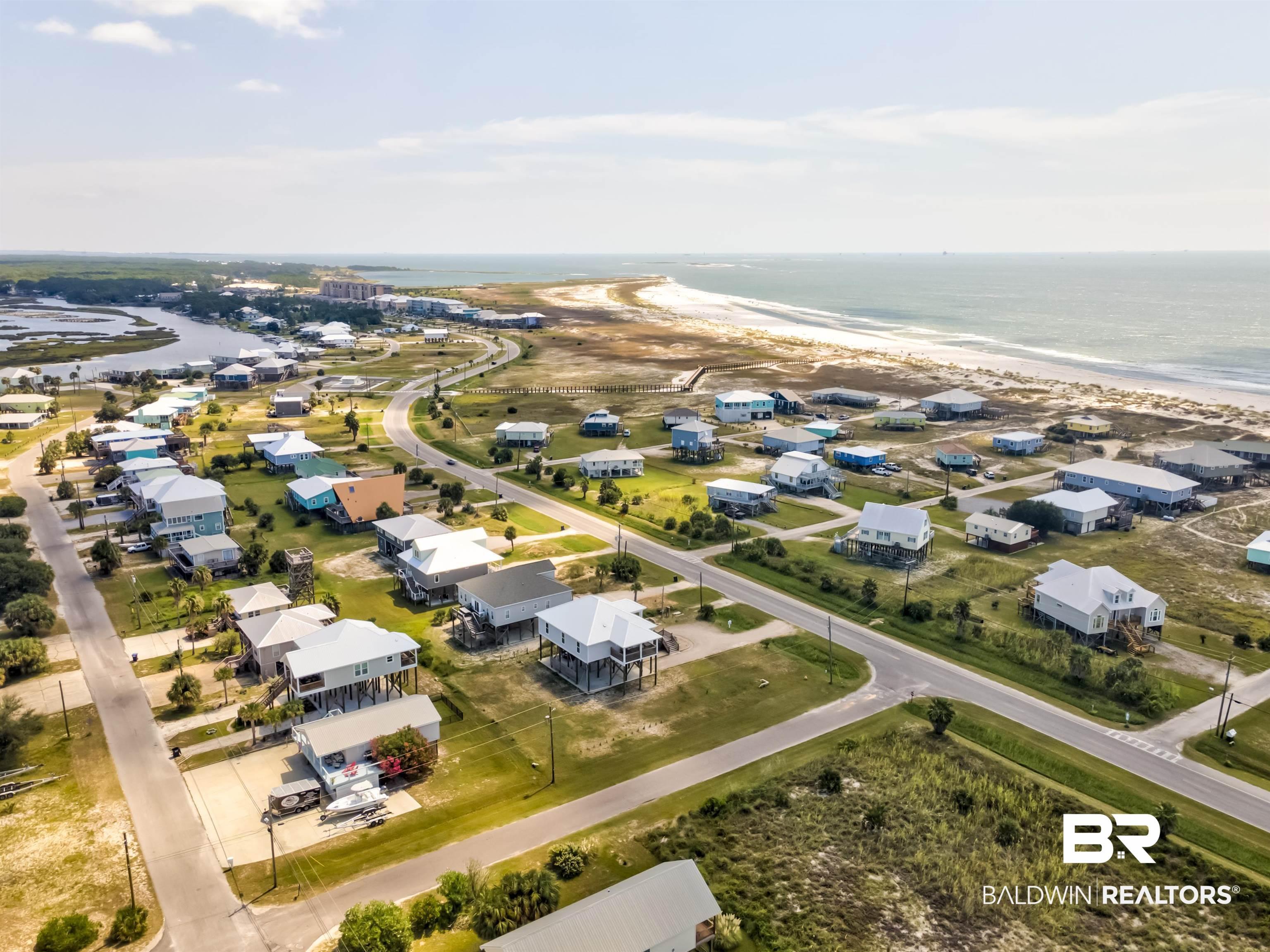 Image 2: Aerial view of residential area with extended coastline