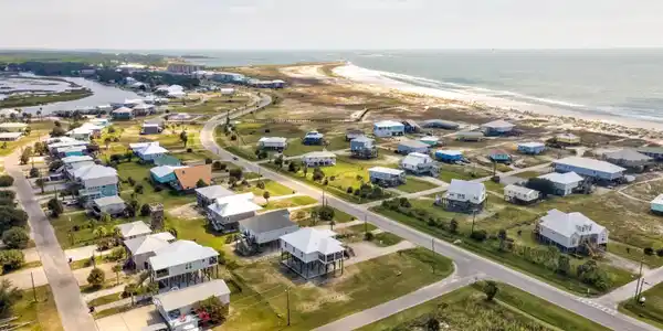 Image 2: Aerial view of residential area with extended coastline