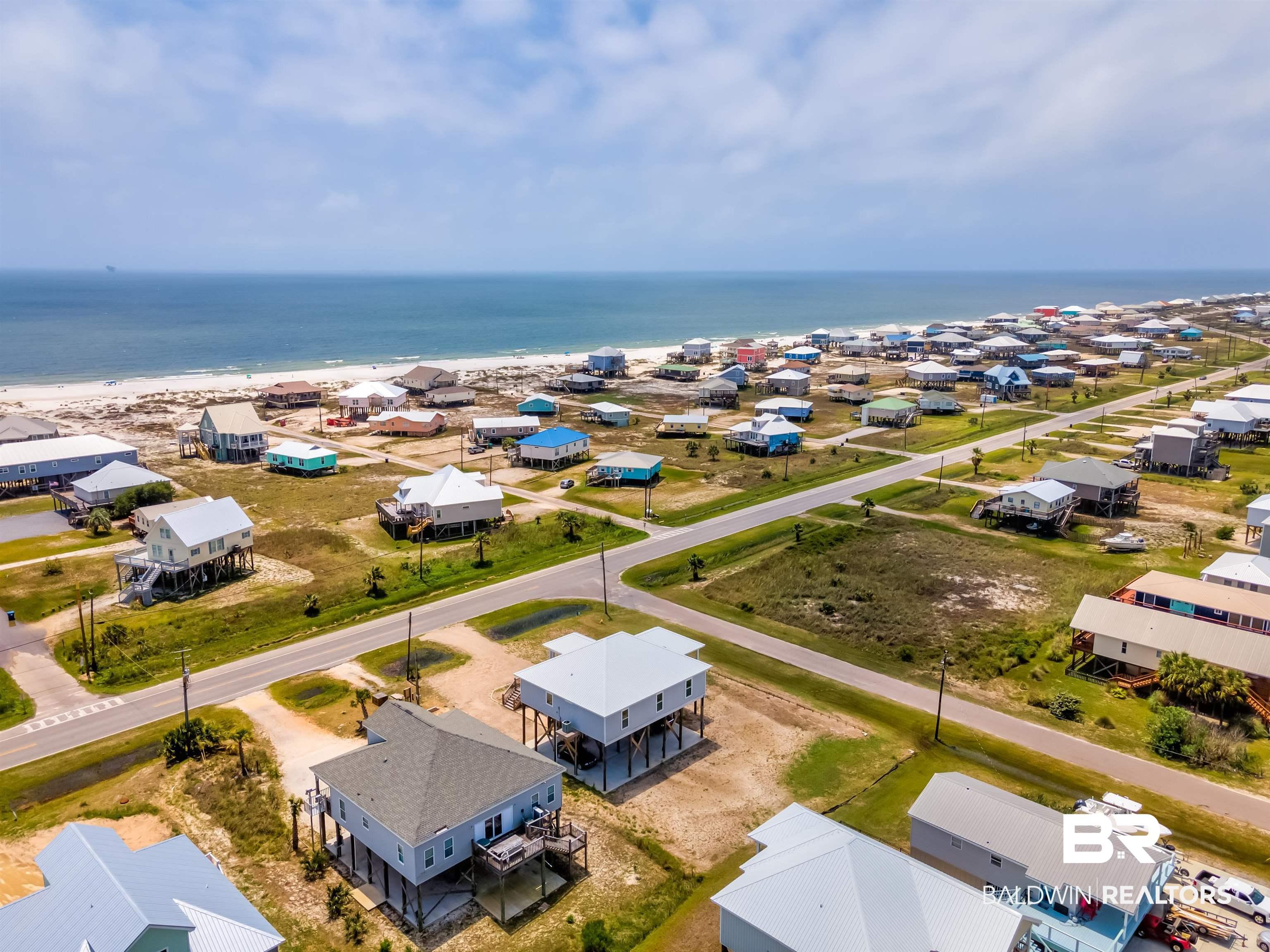 Image 3: Aerial view of residential area featuring a large body of water