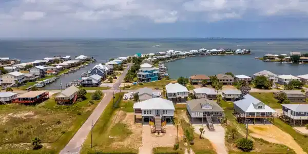 Image 4: Aerial view of residential area with a large body of water
