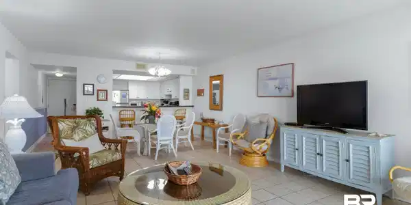Image 4: Open concept living area featuring tile flooring throughout