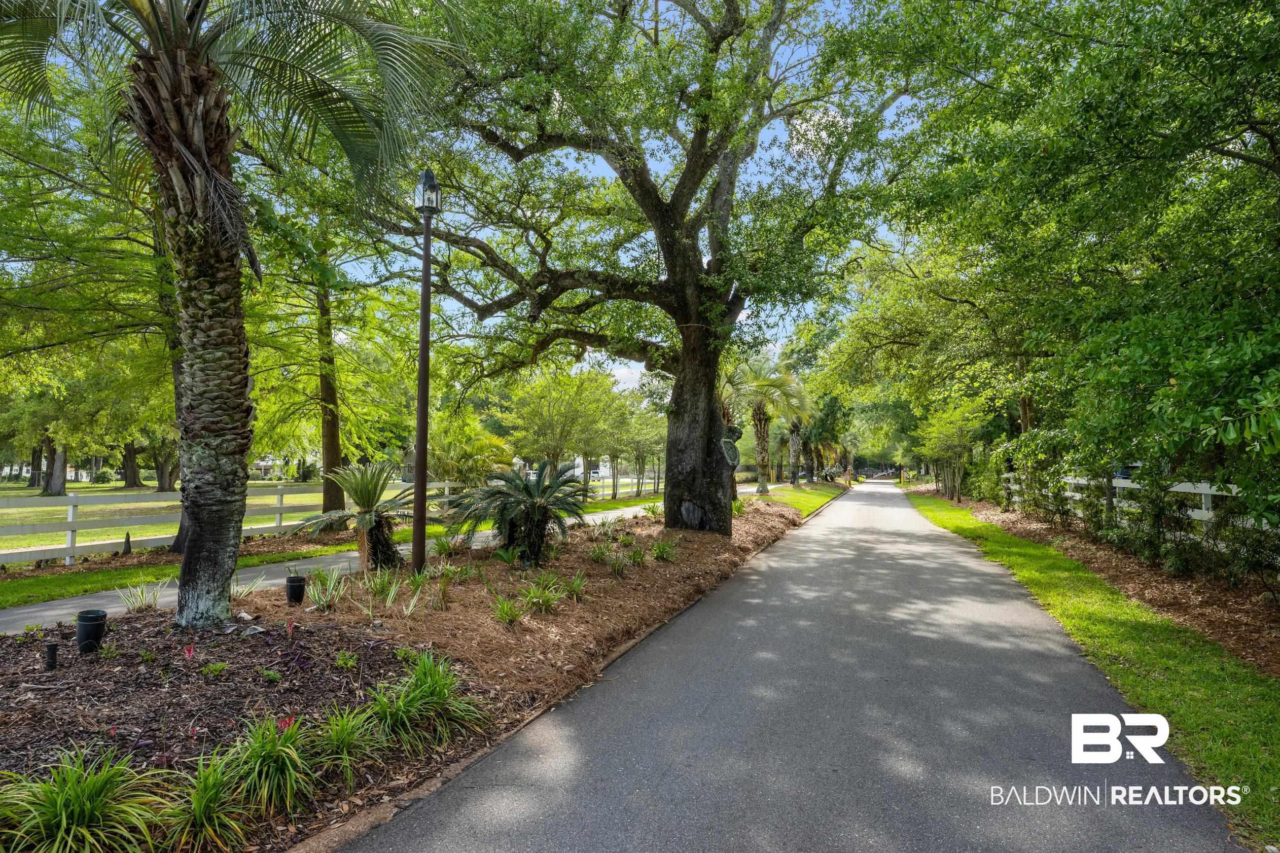 Image 4: View of community featuring view of wooded area