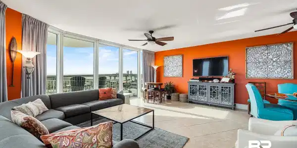 Image 3: Tiled living room with a wall of windows, ceiling fan, and a textured ceiling