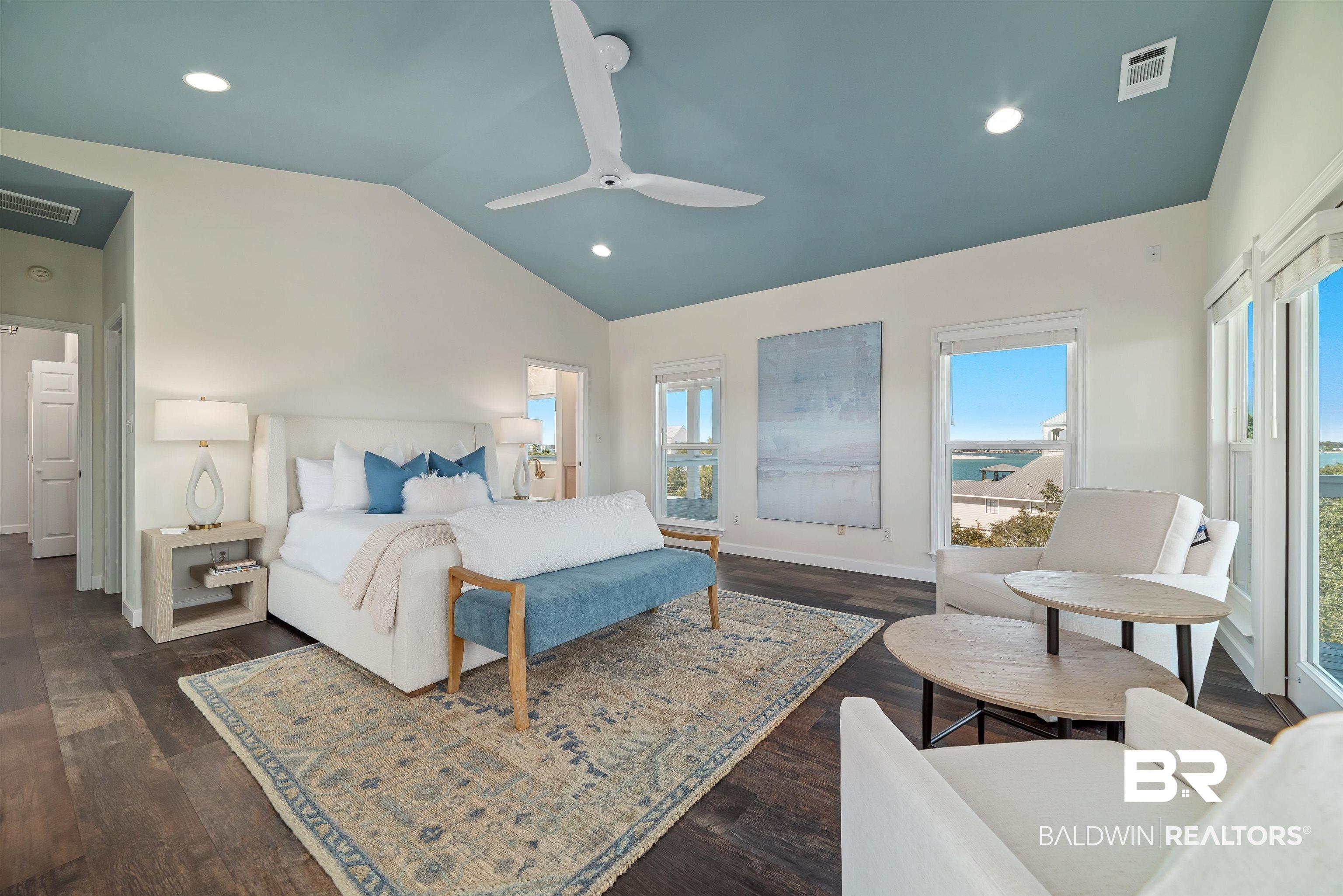 Image 4: Bedroom with vaulted ceiling, ceiling fan, dark wood-style flooring, and recessed lighting