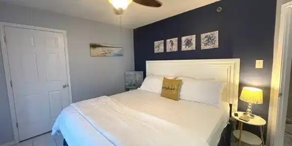 Image 4: Tiled bedroom featuring a textured ceiling and a ceiling fan