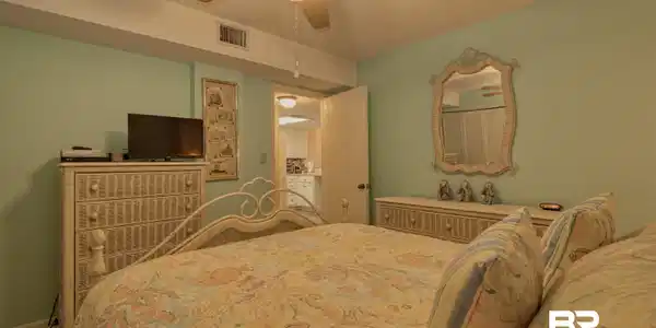 Image 4: Bedroom with ceiling fan and a textured ceiling