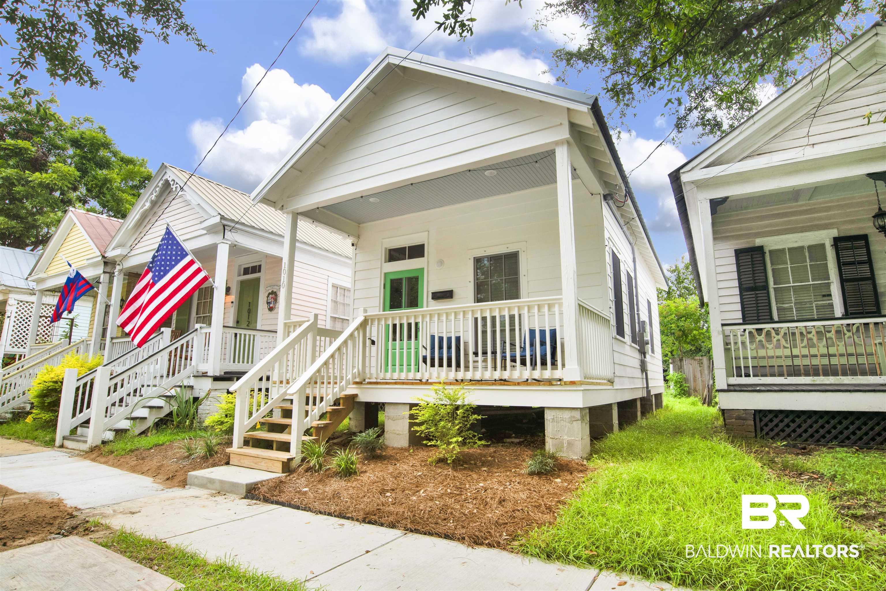 Image 2: Shotgun-style home with covered porch