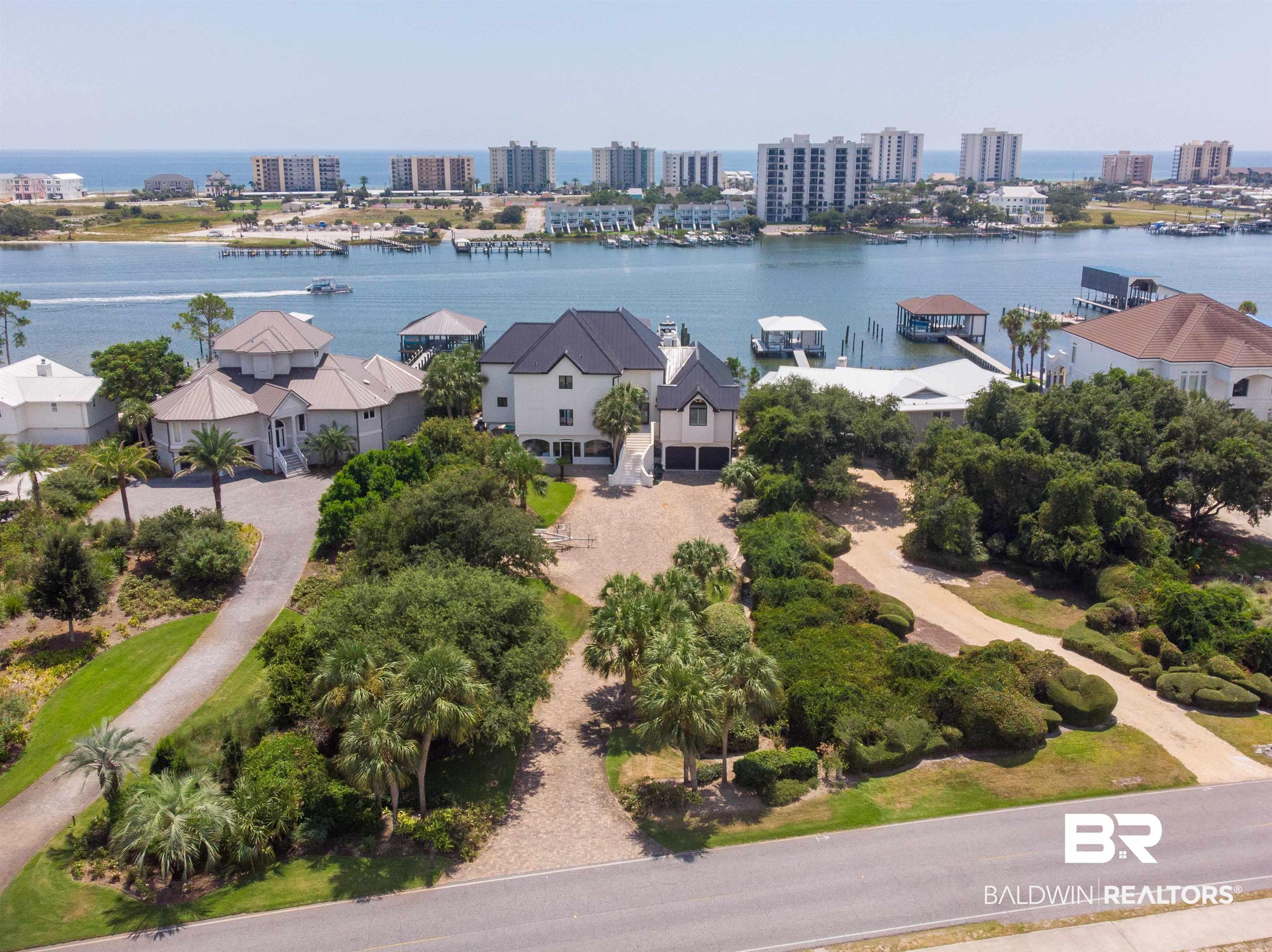 Image 1: Bird's eye view with a water view