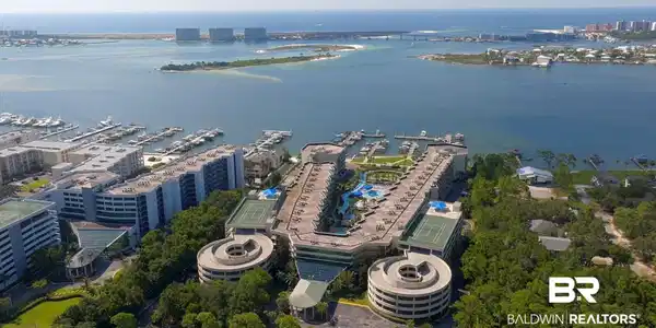Image 2: View of urban area with a nearby body of water and numerous boat docks