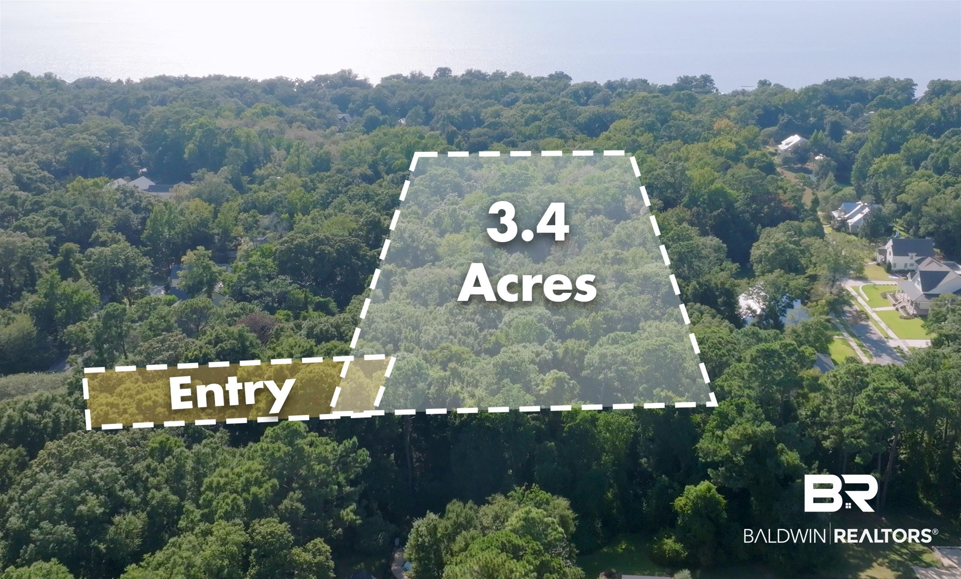Image 1: Aerial overview of property's location featuring a heavily wooded area and property boundaries highlighted