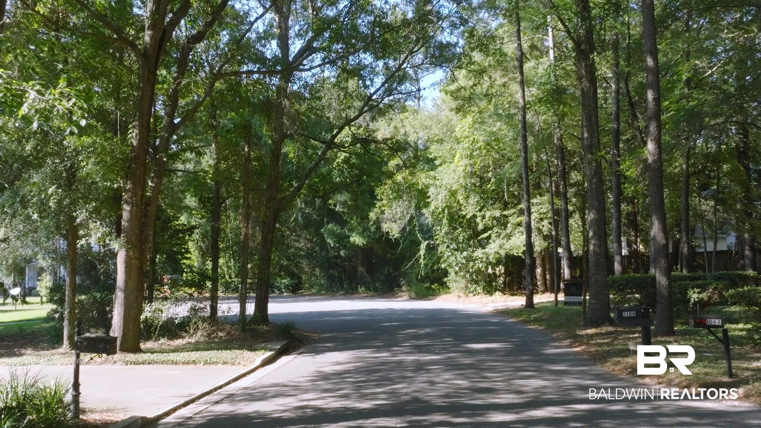 Image 4: Surrounding community featuring a view of trees