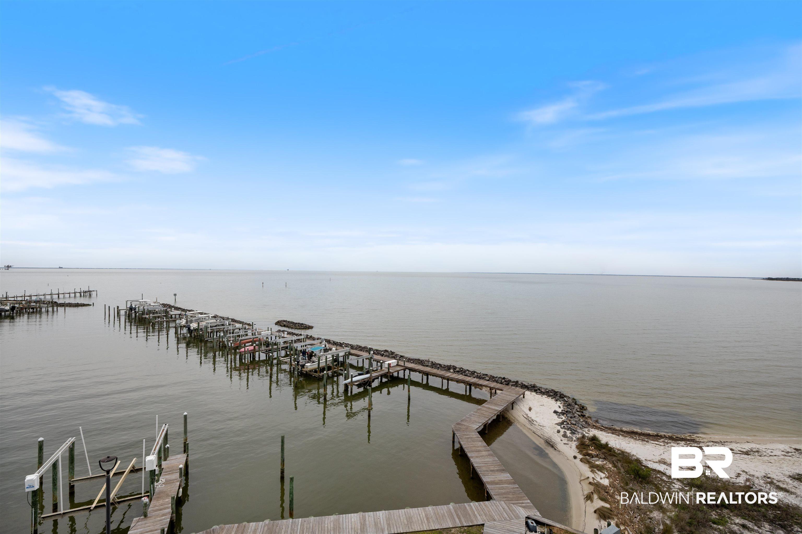 Image 2: Water view with a dock