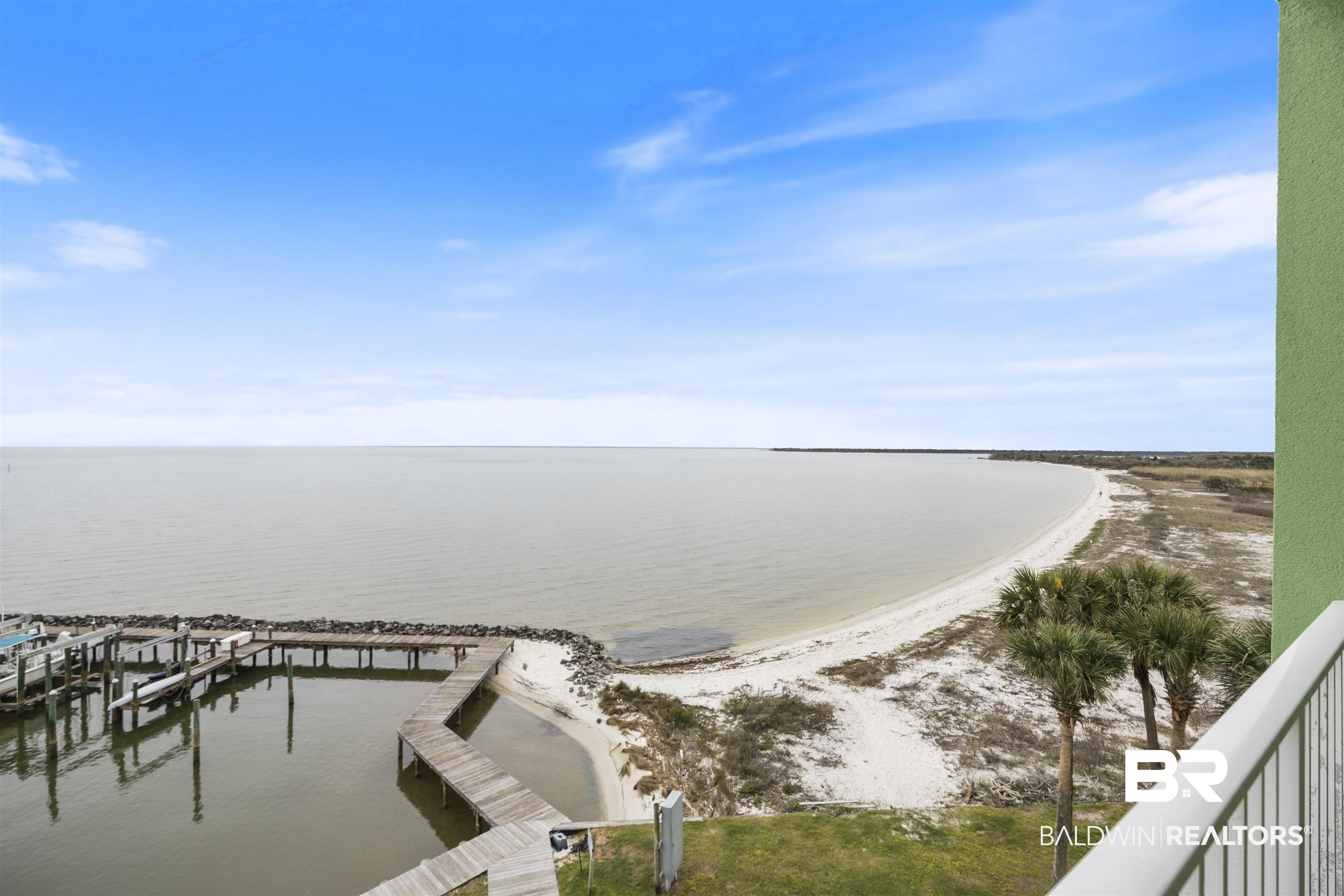 Image 4: Water view with a boat dock