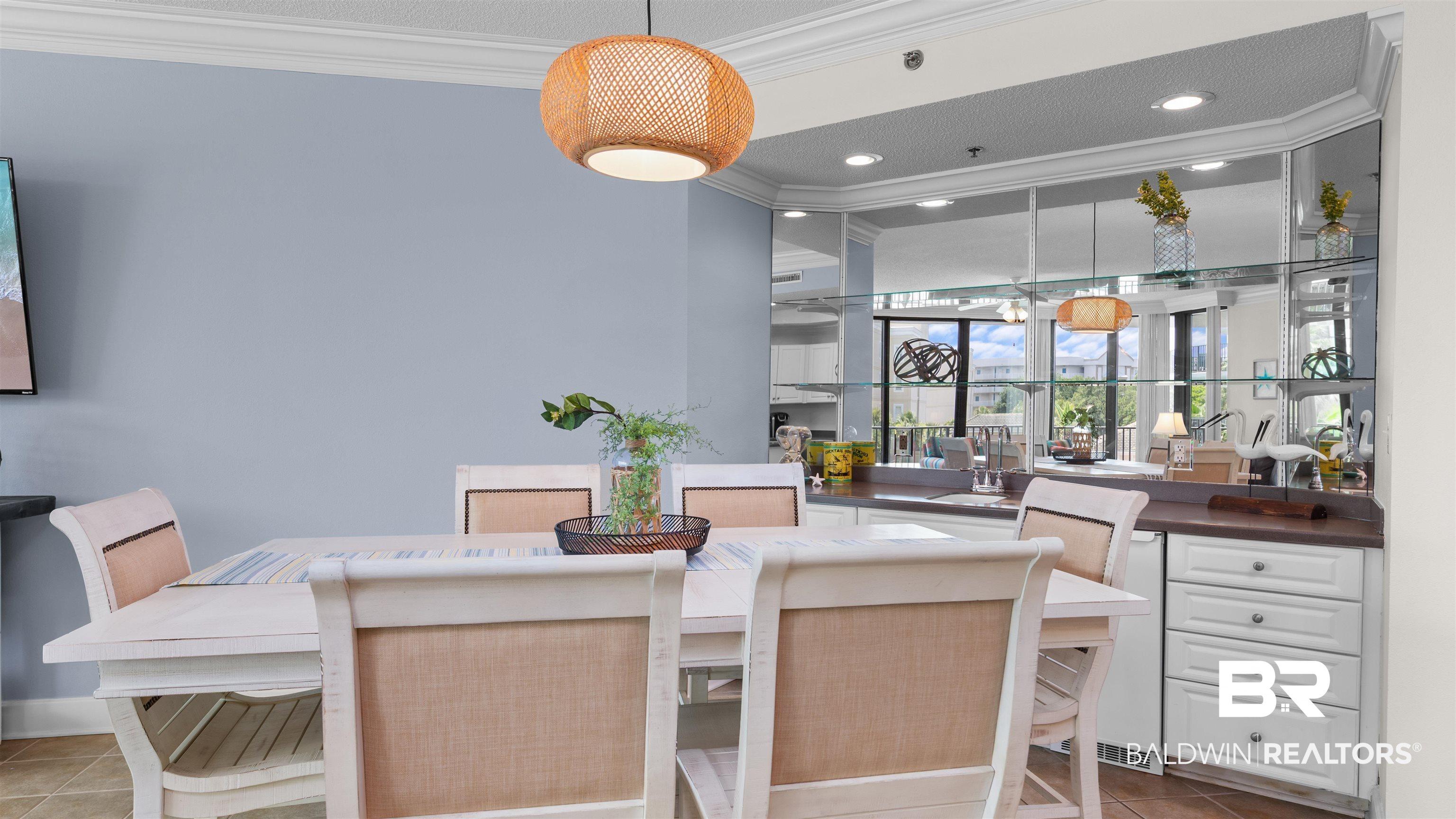Image 4: Dining space featuring crown molding, light tile patterned floors, and recessed lighting