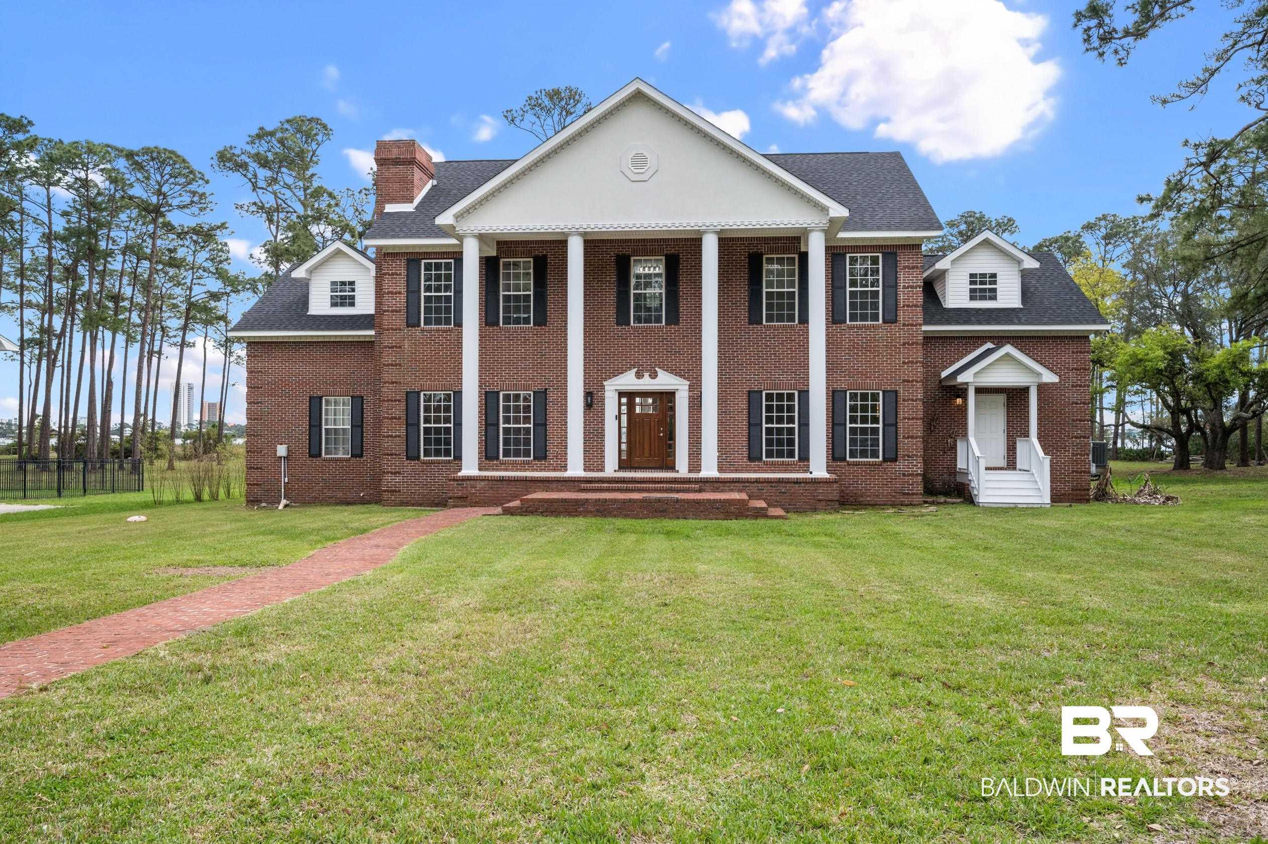 Image 3: Greek revival inspired property featuring a front lawn