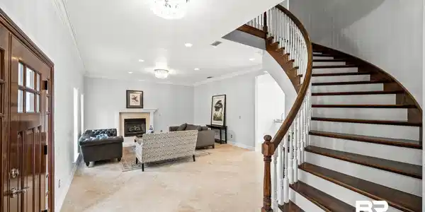 Image 4: Foyer entrance featuring light tile patterned floors and ornamental molding