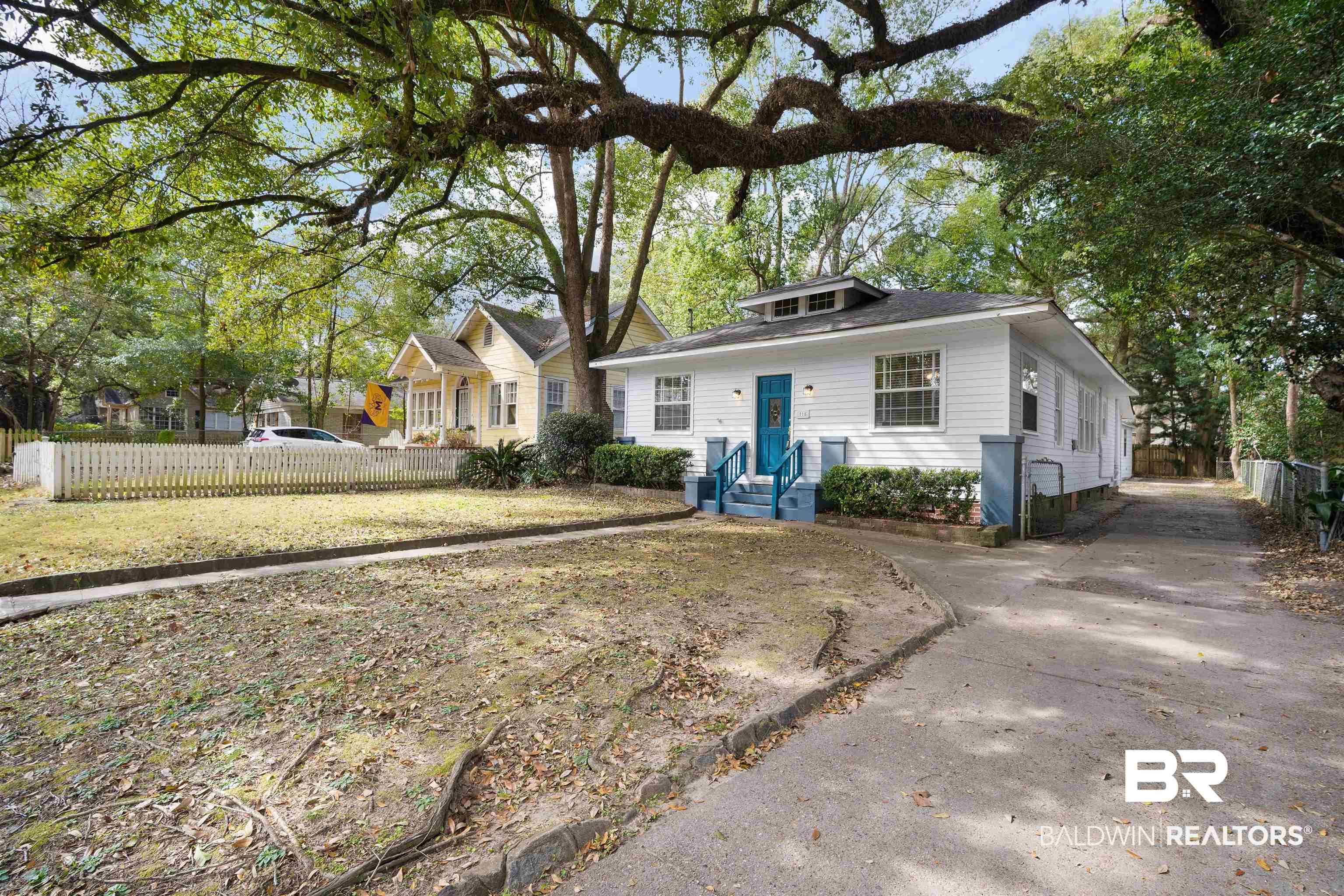 Image 2: Bungalow-style house featuring driveway