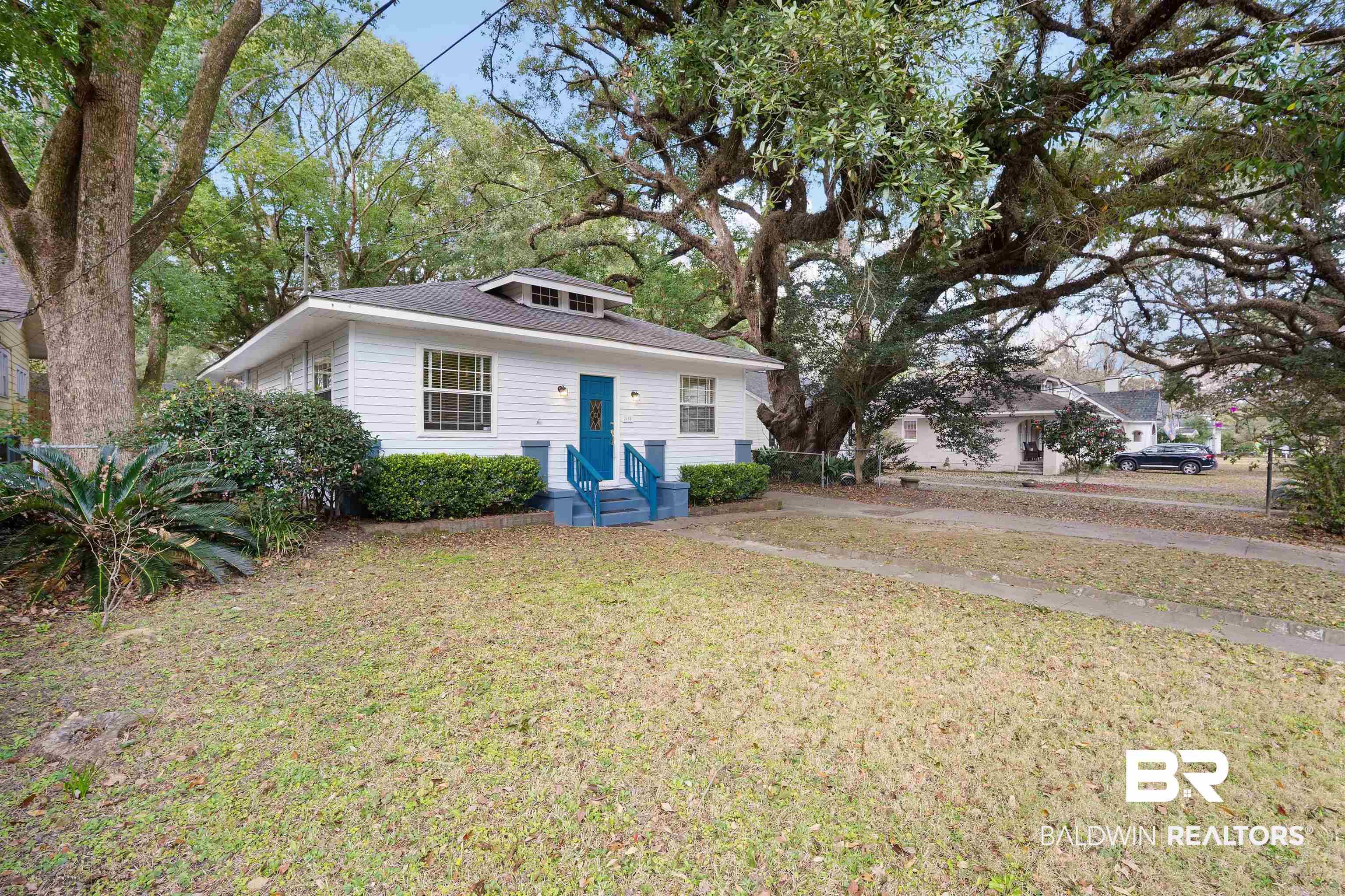 Image 3: Bungalow featuring a front yard